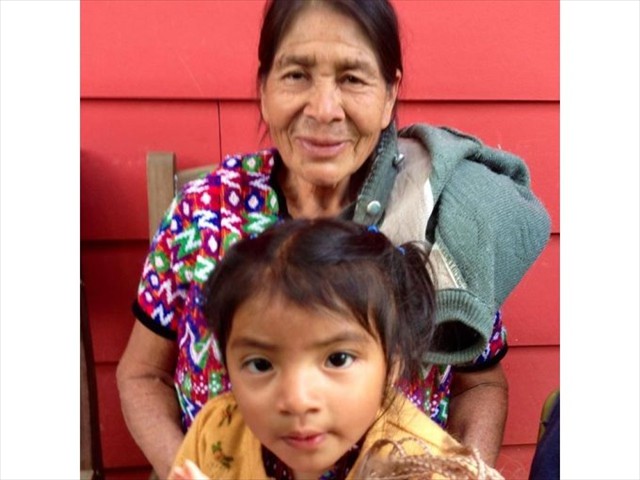 Mayan Grandmother and Granddaughter attending the fiesta.