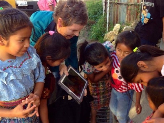 Susan and Frankie sharing photos of the Mayan children. This is the first time that they ever saw a photo of themselves. PRICELESS!