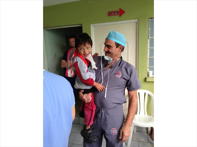 Doctor Ricky playing with his special patient before surgery at Metropolitan Hospital, Guatemala City, Guatemala. 