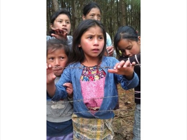 Mayan Indian children watching us start the construction of the children's hospice in Tecpan, Guatemala.