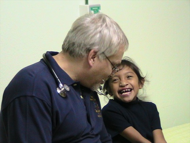 Dr. Todd Bolitan interviewing a Guatemalan child in need of surgery. So much love and hope!