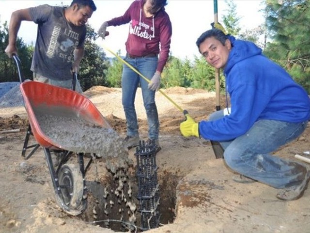 Holes, rebar, cement, teamwork and you have the beginning of a hospice for the children.
