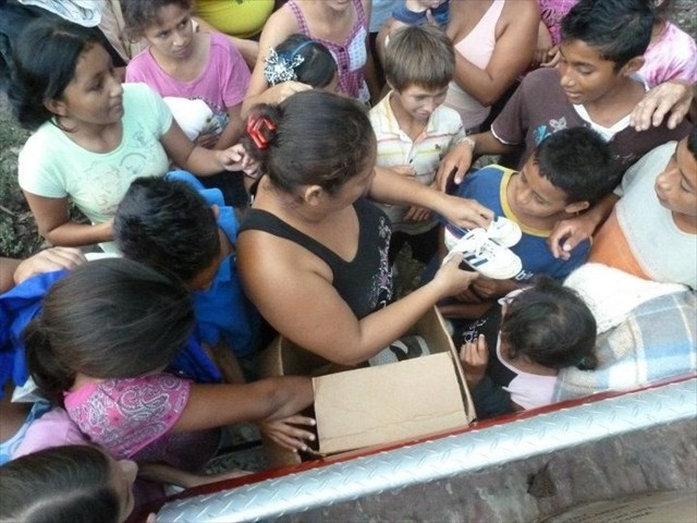 Boxes of Mission of Love shoes being distributed in the Honduran communities.