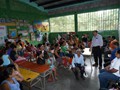 Julio speaking to the parents and grandparents in regard to the Mission of Love donation of educational supplies that will benefit the children via a education.