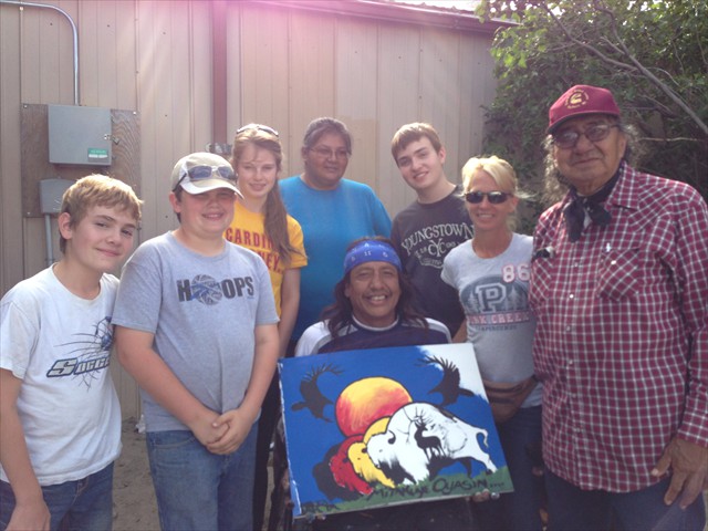 Josephine Standing Soldier, Kevin Poor Bear, Hobart Spotted Bear presenting artwork of Kevin's to the Mission of Love volunteers while on the Pine Ridge Native American Indian Reservation while building a family a Lakota Home. 