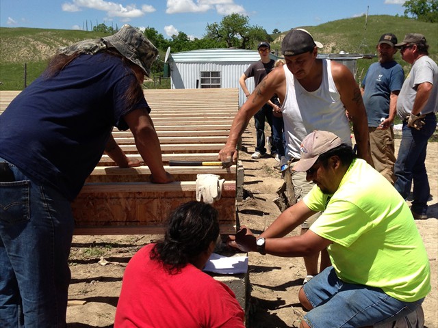 The flooring being built with ALL Lakota hands.