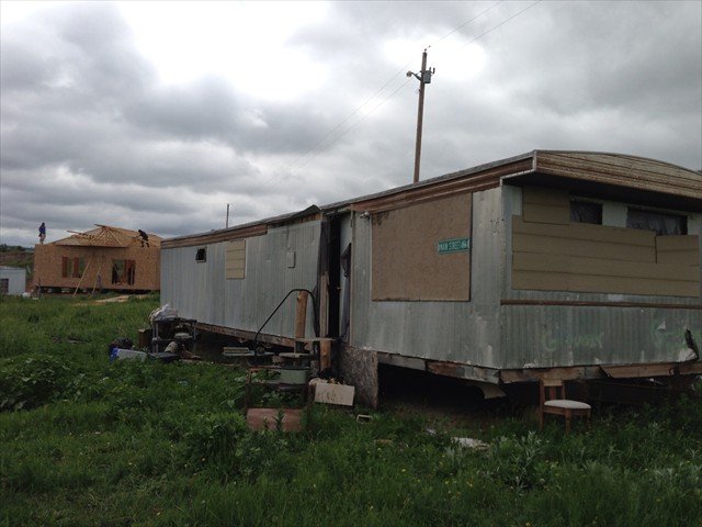 Former Camp Trailer with new construction of the new Lakota Camp home in the background. A great week of love and gratitude.