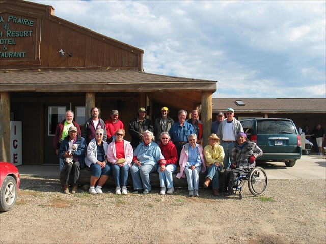 Mission of LOVE volunteers with Hobart Spotted Bear, Alex White Plume, Rusty Puckett, and Kevin Poor Bear in front of the Lakota Prairie Ranch.