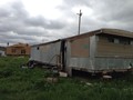 Former Camp Trailer with new construction of the new Lakota Camp home in the background. A great week of love and gratitude.