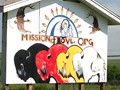 Mission of LOVE logo painted by Lakota artist, Kevin Poor Bear on a billboard in Kyle, S.D.
