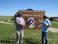 Placing a sign at the Lakota Circle Village are Hobart Spotted Bear and Donnie Shocky. Both Donnie and Hobart received a Sacred Lakota Home from our Mission of LOVE building team.
