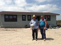 Hobart Spotted Bear, Charlie and Rusty Puckett in front of the White Bull Family Home.<br/>One of thirty homes that were built and donated on the Pine Ridge Native American Indian Reservation by the Mission of LOVE Volunteers.<br/>