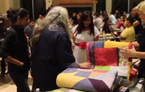 Kathy Price and Andrea Thome distributing comfort quilts